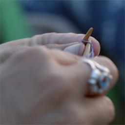 Still from By the Fire, a close-up shot of hands knitting.